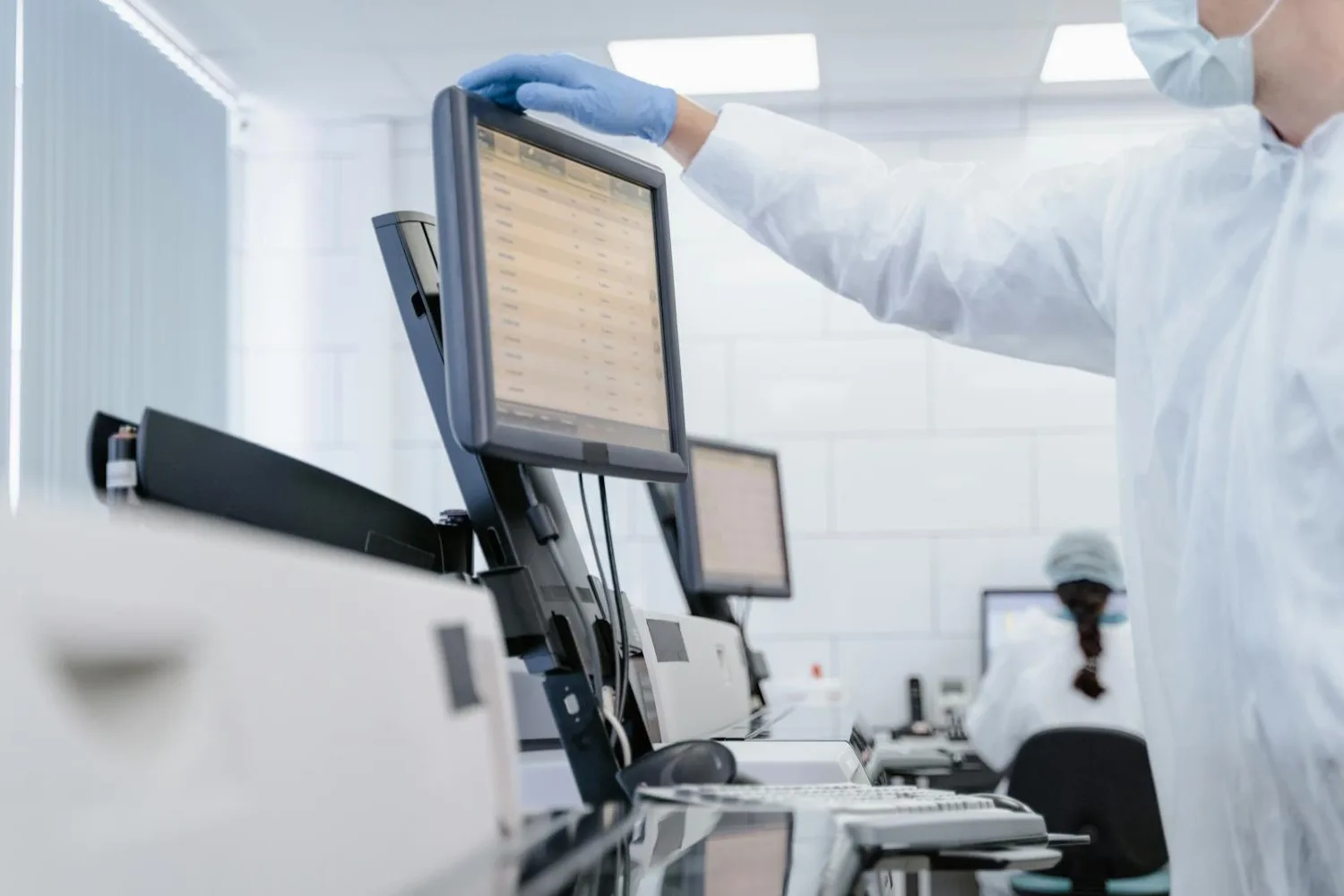 A researcher reviewing physiological data in a clinical research setting.